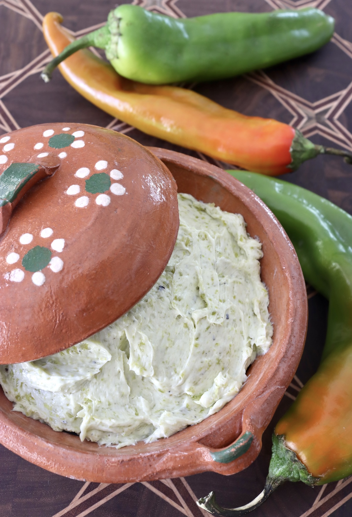 Hatch chile butter in a terra cotta bowl.