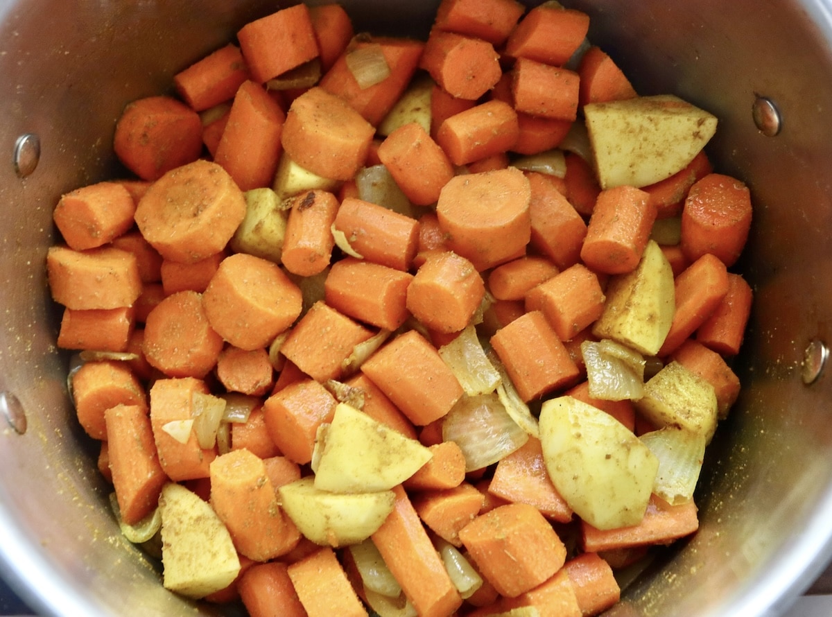 Coconut-Spiced-Carrot-Soup Very slightly cooked chopped carrots and potatoes with cardamom, cumin and turmeric sprinkled on top.