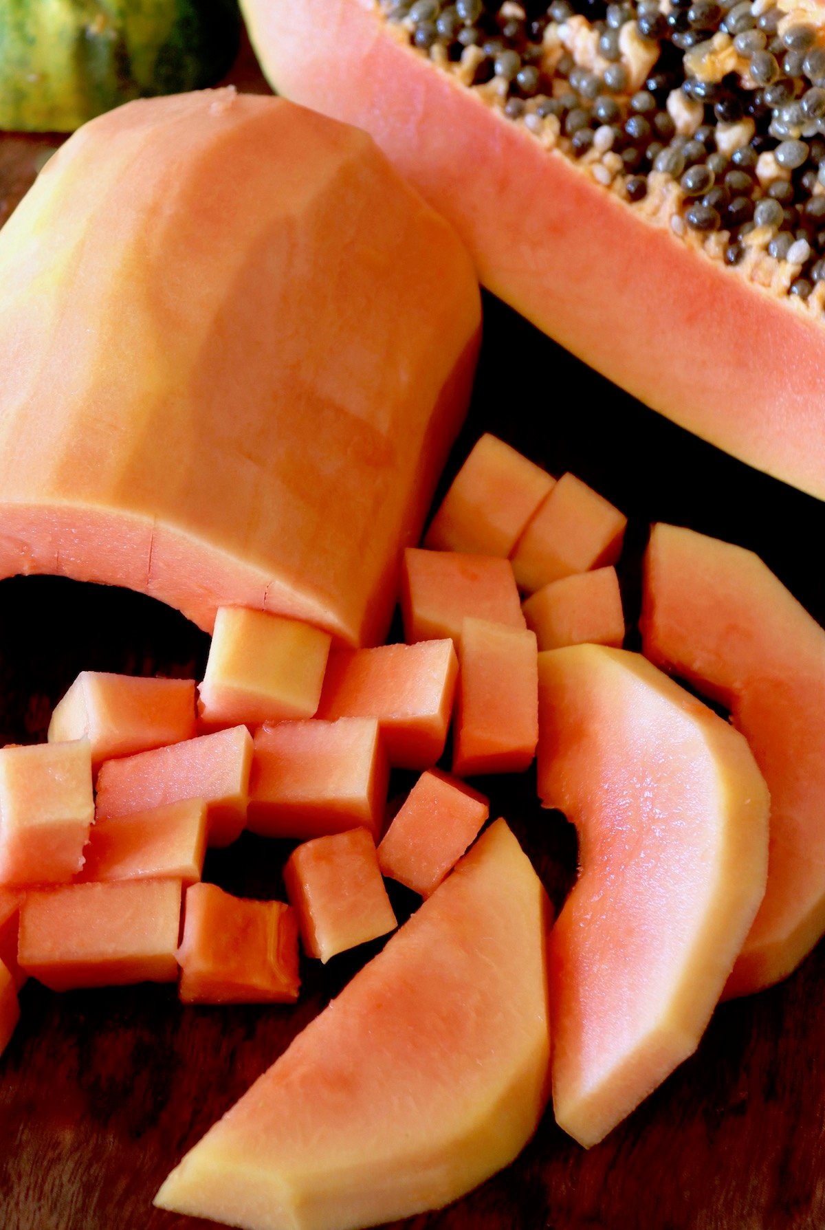 skinned papaya in slices and chunks