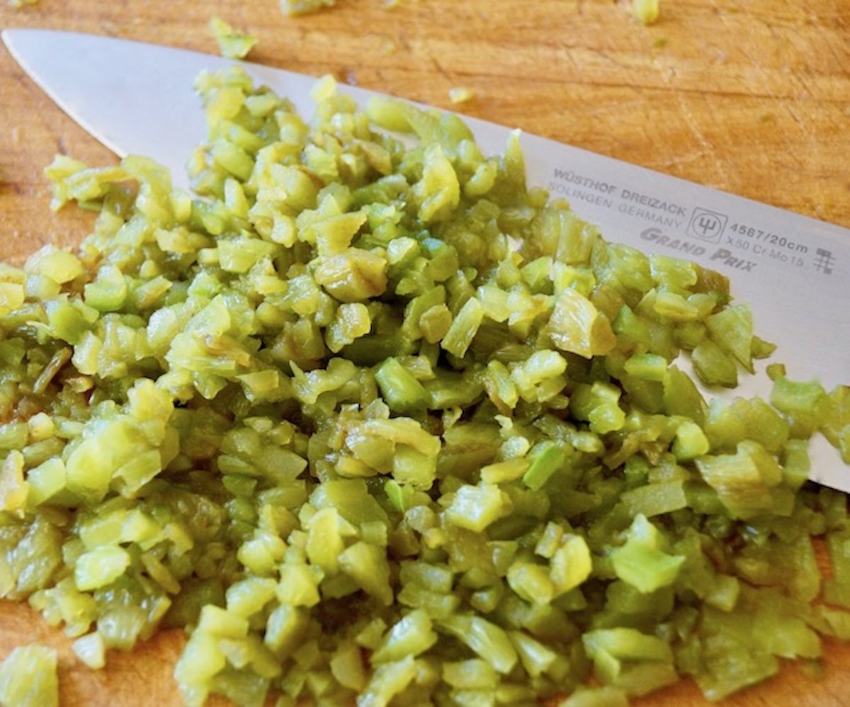 Pile of finely chopped roasted and peeled Hatch chile peppers.
