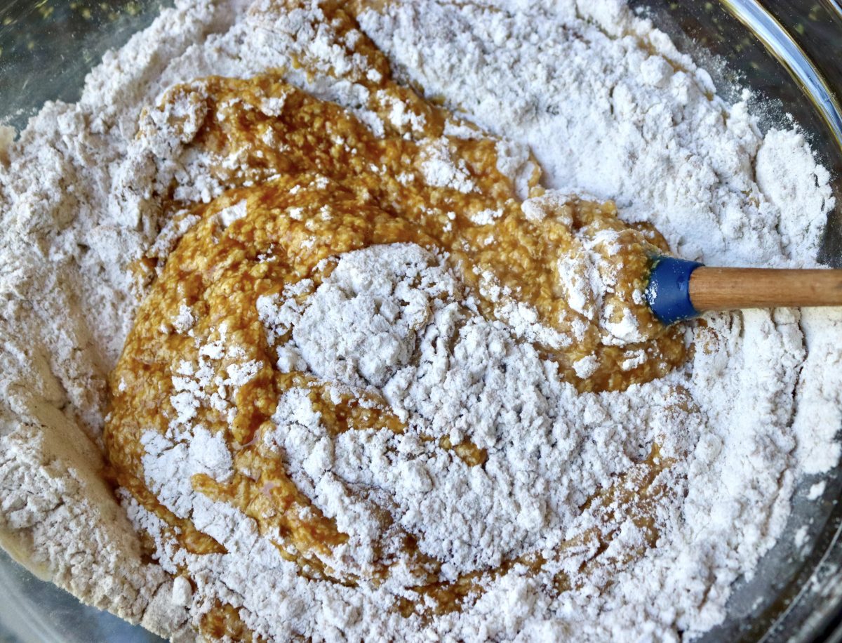 Pumpkin-Coffee-Cake-with-Streusel-and-Caramel Pumpkin mixture with butter being mixed into a dry flour mixture for pumpkin coffee cake with streusel.