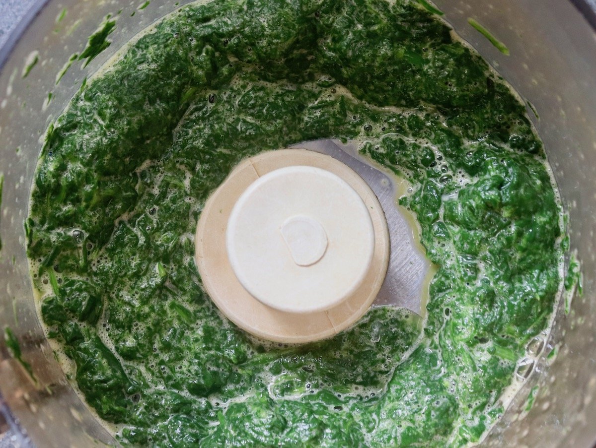 Spinach that's been puréed with eggs in a food processor.