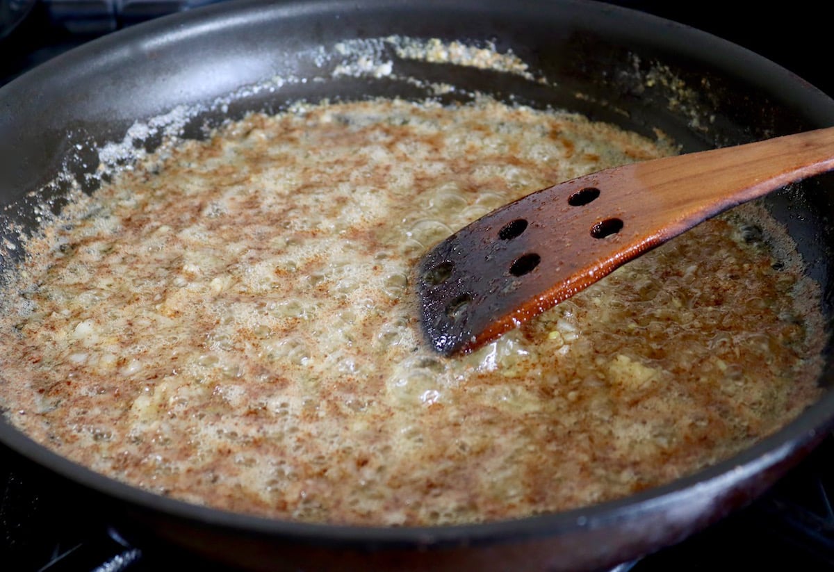 Brown butter mixed with shallots and garlic in a large skillet.