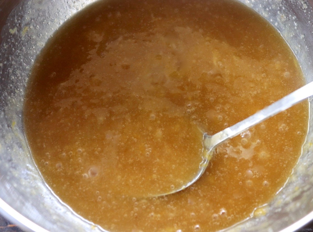 Bowl of combined wet ingredients for batter including melted butter.