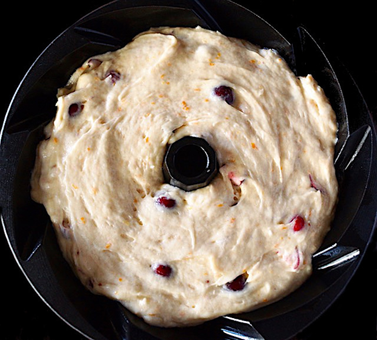 Top of bundt cake pan with cake batter in it.