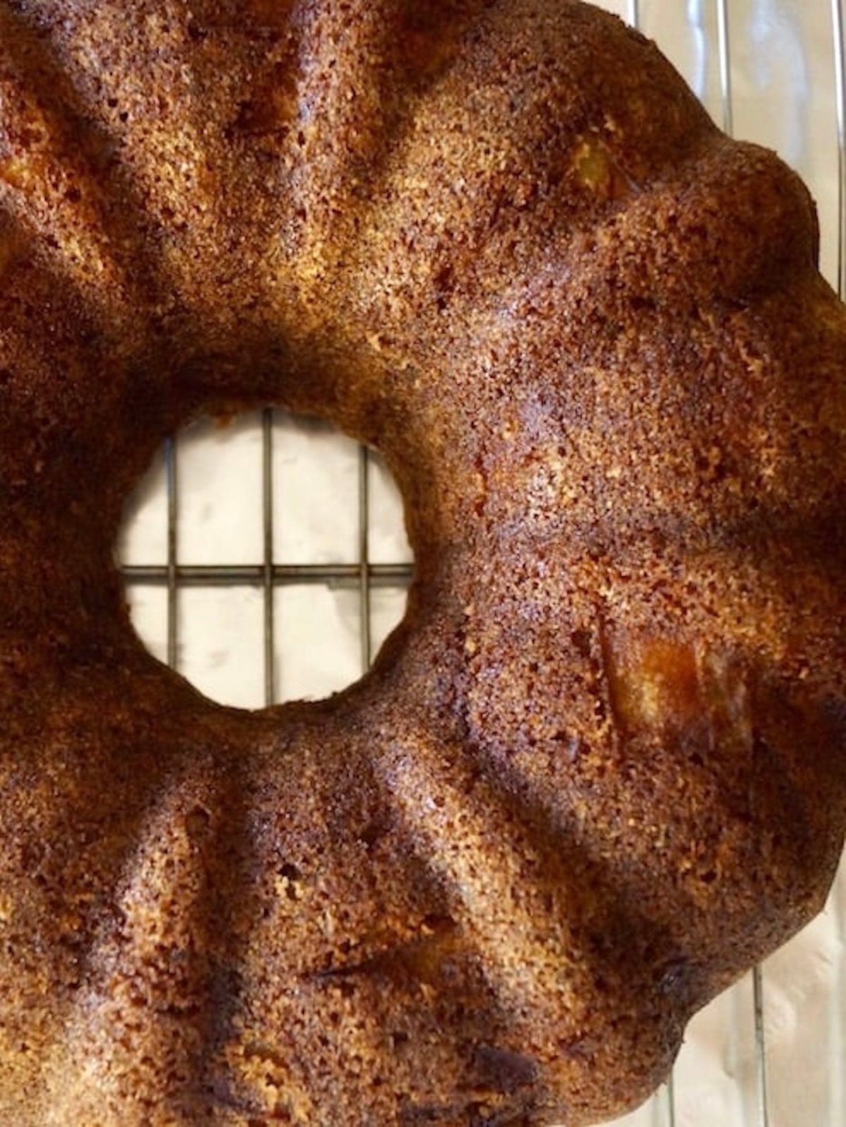 Top view of baked chai bundt cake on a cooling rack.