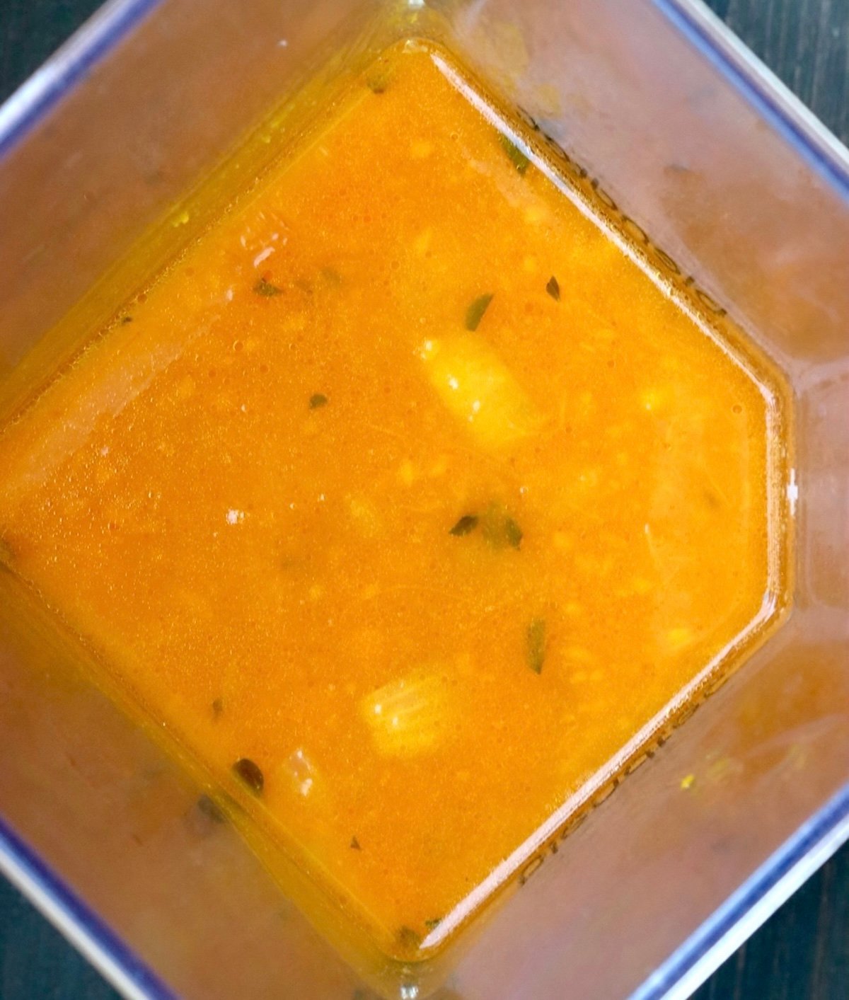 Ingredients for kuri squash soup in a blender not yet blended.