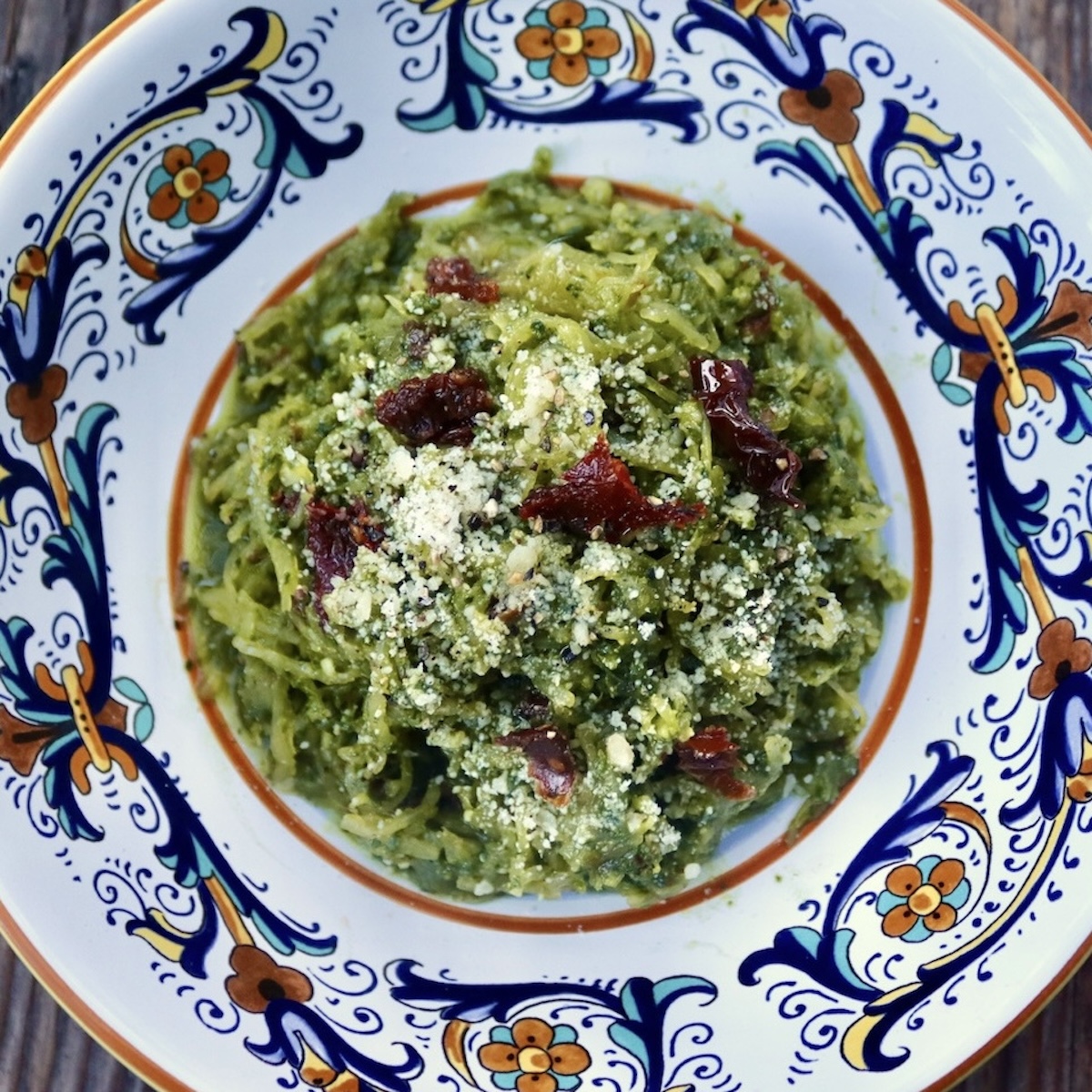 Spinach Pesto Spaghetti Squash in a pretty Italian painted pasta bowl.