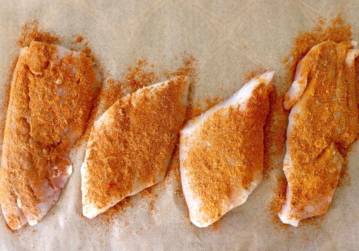 Baked-Red-Snapper-Recipe 4 fillets of red snapper with a spice rub on top.