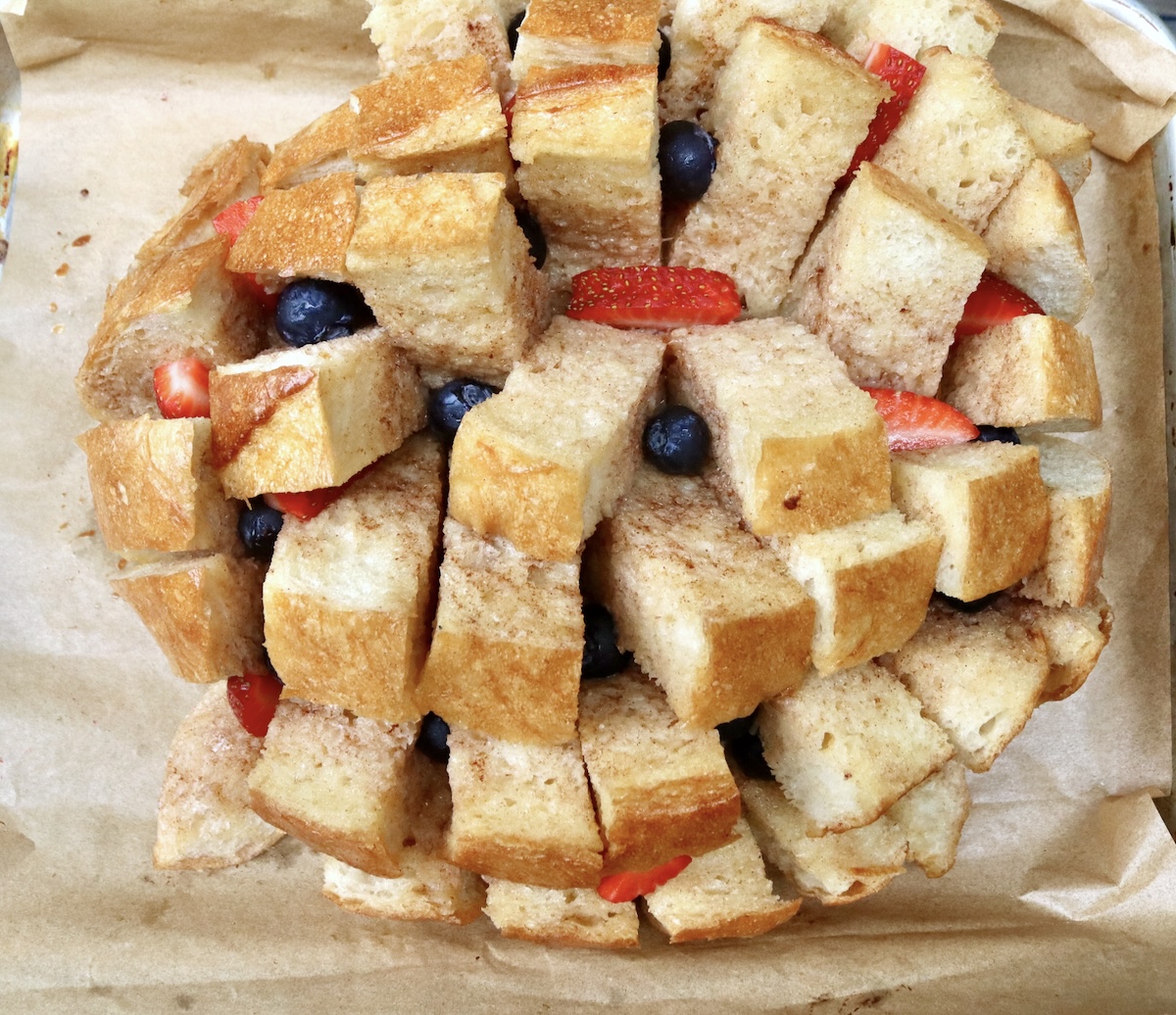 Pull-Apart French Toast Pull apart French toast with a few berries between the pieces.