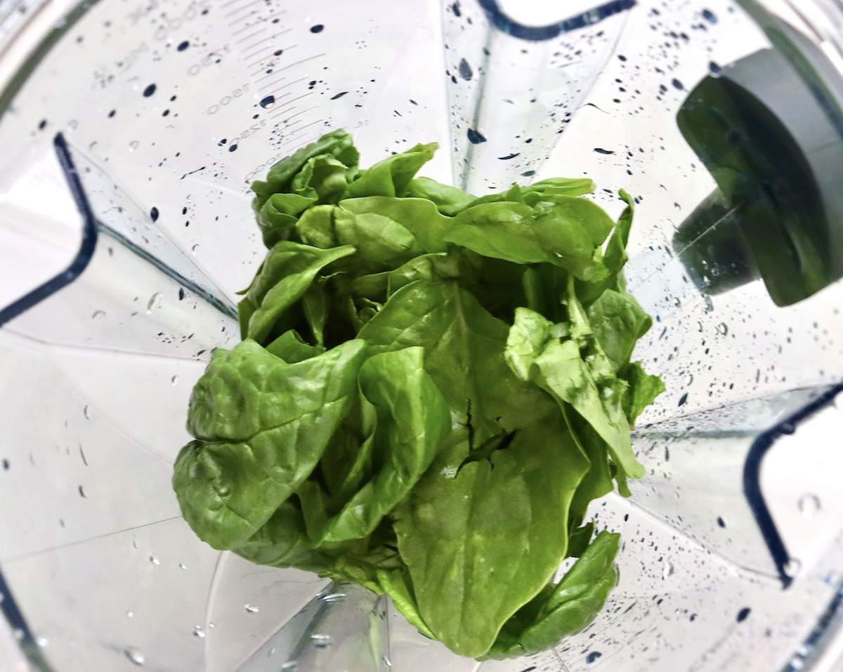 Pistachio-Soup-Recipe Spinach in a blender.