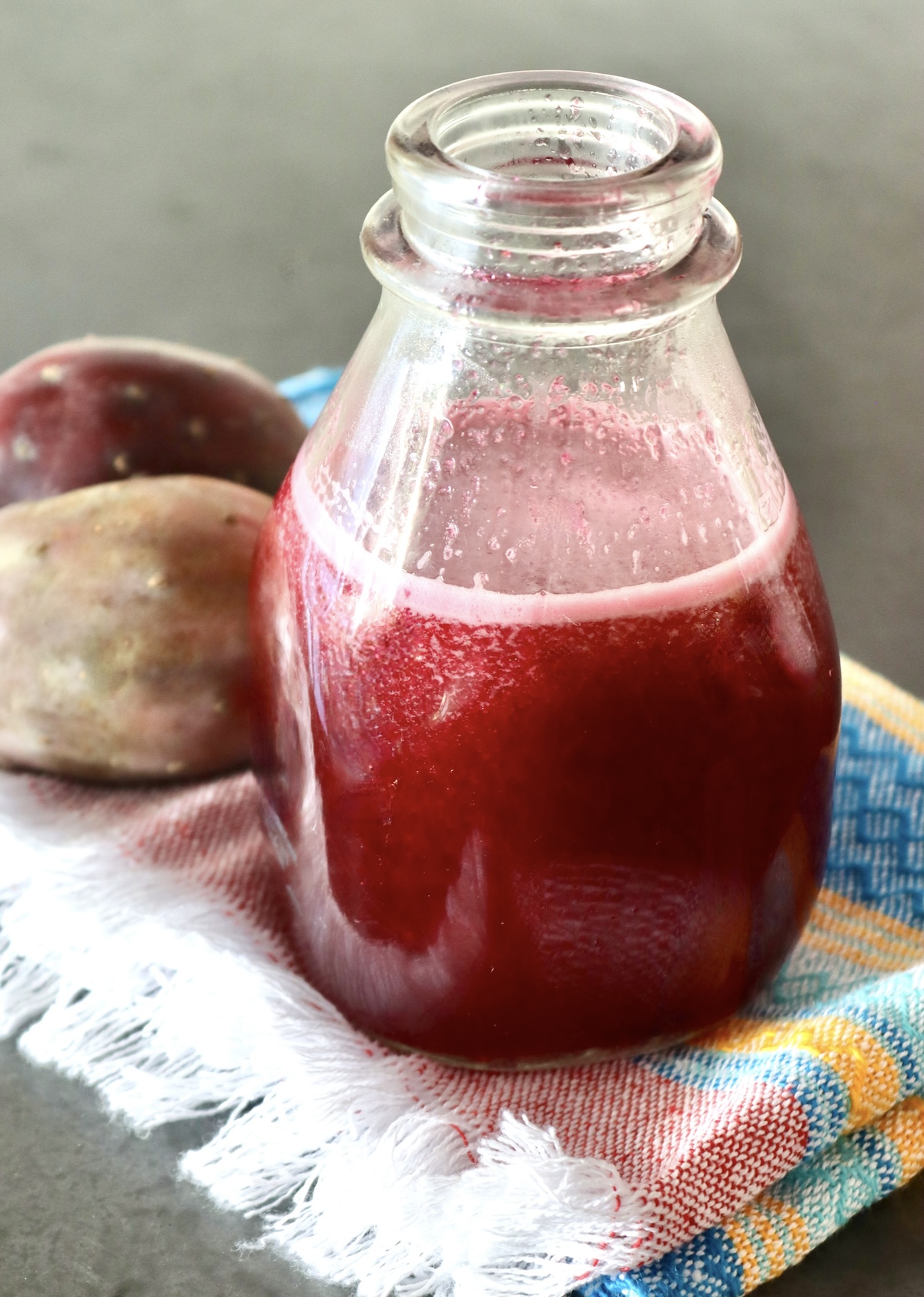 Prickly Pear syrup in a bottle without a lid.